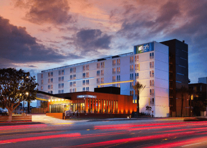 Exterior nighttime image of the Aloft hotel in El Segundo